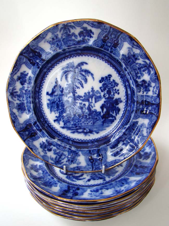 A magnificent set of eight antique Flow Blue "KYBER' pattern dinner plates circa 1840 by William Adams & Co., England.